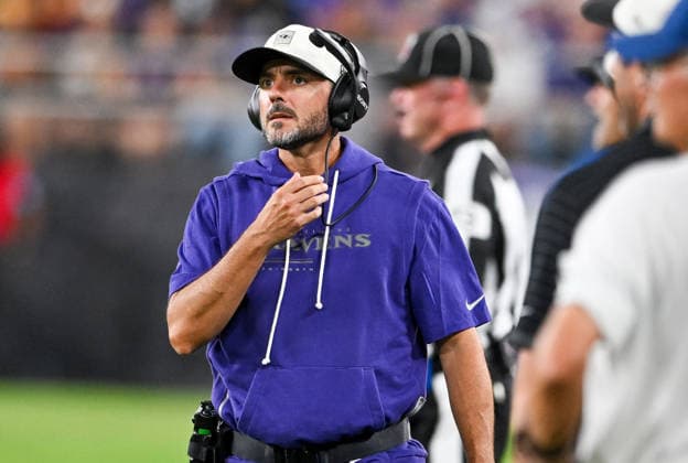 Baltimore Ravens head coach Jesse Minter walks the sideline against the Washington Commanders during the fourth quarter of a preseason game at M&T Bank Stadium in Baltimore, Maryland, on Friday, August 28, 2026. The Ravens won 41-3.  BAL20260828121 DAVIDxTULIS