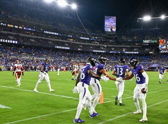 Baltimore Ravens wide receiver Cornelius Johnson (86) celebrates a 20 yard touchdown catch against the Washington Commanders during the fourth quarter of a preseason game at M&T Bank Stadium in Baltimore, Maryland, on Friday, August 28, 2026. The Ravens won 41-3.  BAL20260828126 DAVIDxTULIS