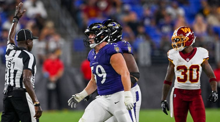 Baltimore Ravens defensive tackle Aaron Graves (59) celebrates a Washington Commanders quarterback sack for a loss during the fourth quarter of a preseason game at M&T Bank Stadium in Baltimore, Maryland, on Friday, August 28, 2026. The Ravens won 41-3.  BAL20260828131 DAVIDxTULIS