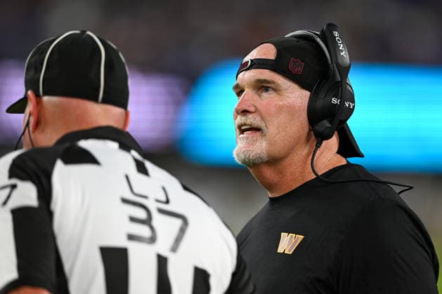 Washington Commanders head coach Dan Quinn talks to line judge Tripp Sutter (37) during the fourth quarter of a preseason game at M&T Bank Stadium in Baltimore, Maryland, on Friday, August 28, 2026. The Ravens won 41-3.  BAL20260828132 DAVIDxTULIS
