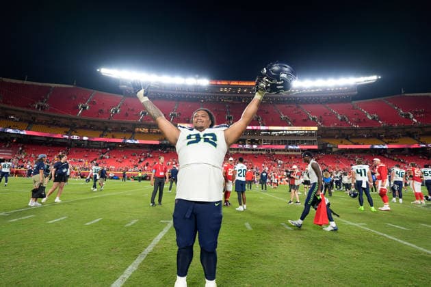 Seattle Seahawks defensive lineman Uso Seumalo (92) gets a shout out from fans after the preseason game against the Chiefs at Arrowhead Stadium in Kansas City, Missouri on Friday August 28, 2026.  KCP2026082825 JONxROBICHAUD