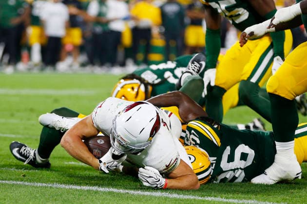GREEN BAY, WI - AUGUST 28: Arizona Cardinals running back Evan Hull (43) is stopped short of the end zone by Green Bay Packers defensive back Kamal Hadden (36) during a preseason game between the Green Bay Packers and the Arizona Cardinals on August 28, 2026 at Lambeau Field, in Green Bay, WI. (Photo by Larry Radloff Icon Sportswire) NFL, American Football Herren, USA AUG 28 Cardinals at Packers EDITORIAL USE ONLY Icon202608285874