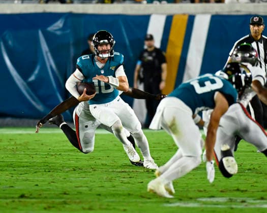 Jacksonville Quarterback Carter Bradley scrambles for short yardage in the third quarter as the Jaguars compete against the Buccaneers at EverBank Stadium in Jacksonville, Florida on Friday August 21, 2026. The Jaguars defeated the Bucs 19-0.  JAX20260828013 JOExMARINO