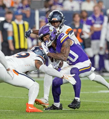 August 28, 2026, Denver, Colorado, USA: VIKINGS WR TERRIL DAVIS gets hit by the Broncos Defense after a catch during the 2nd. Half at Empower Field at Mile High Friday evening. Broncos beat the Vikings 34-6 in Pre-Season play. Credit Image: ZUMA Press Wire) Denver USA - ZUMAav4_ 20260828_zaf_av4_008 Copyright: xHectorxAcevedox