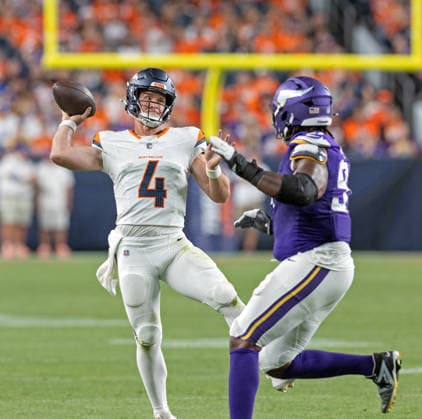 August 28, 2026, Denver, Colorado, USA: Broncos QB SAM EHLINGER readies to throw his 2nd. TD pass of the game to team-mate RB Cody Schrader in the end zone during the 2nd. Half at Empower Field at Mile High Friday evening. Broncos beat the Vikings 34-6 in Pre-Season play. Credit Image: ZUMA Press Wire) Denver USA - ZUMAav4_ 20260828_zaf_av4_020 Copyright: xHectorxAcevedox