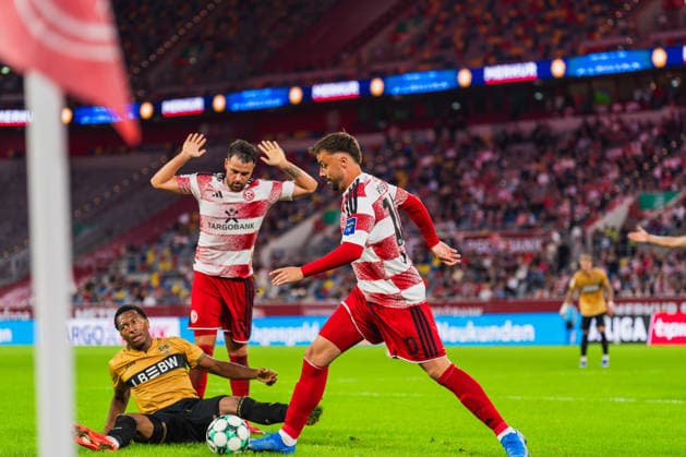 Jarzinho Malanga of VFB Stuttgart II, 27, is on the ground after a tackle with Yassine Bouchama of Fortuna Düsseldorf, 05, who raises his arms, Philipp Foerster (Fortuna Düsseldorf, 10) with the ball; Fortuna Düsseldorf vs. VFB Stuttgart II, soccer, 3rd League, Matchday 3, 2026–27 season, August 28, 2026, DFL regulations prohibit any use of photographs as image sequences and or quasi-video. Fortuna Düsseldorf vs. VFB Stuttgart II, soccer, 3rd Division, Matchday 3, 2026–27 season, August 28, 2026, Düsseldorf Copyright: xEibner-Pressefoto LukasxBaldygax EP_LBA
