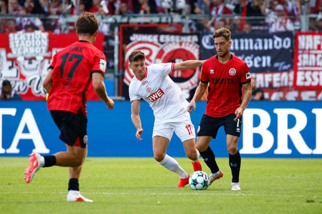 August 29, 2026, xavx, Soccer 3rd Division, SV Wehen Wiesbaden vs. Rot-Weiss Essen; Semir Telalovic (Rot-Weiss Essen), Lukas Schleimer (SV Wehen Wiesbaden), Wiesbaden