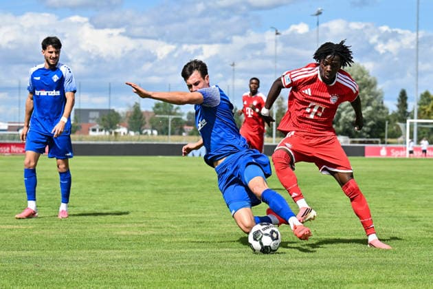 Bavarian Regional League: FV Illertissen vs. FC Bayern Munich II, August 29, 2026, ILLERTISSEN, GERMANY, AUGUST 29: Oluwaseyi WILSON (FC Bayern Munich II, No. 7) and Eduard HECKMANN (FV Illertissen, No. 23) face off during the Bavarian Regional League match between FV Illertissen and FC Bayern Munich II’s reserves on Matchday 6 at Illertissen Stadiumertissen Stadium Copyright: xBEAUTIFULxSPORTS Goldbergx