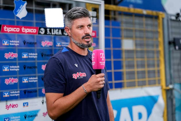Stefan Kleineheismann, Coach, Head Coach, TSG II, single image, single photo, holding a microphone during an interview with Magenta Sport magentaSport, TV, television, August 29, 2026, Sinsheim, Germany, soccer, 3rd Division, TSG 1899 Hoffenheim II vs. SSV Jahn Regensburg; DFB and DFL regulations prohibit any use of photographs as image sequences and or quasi-video xozx