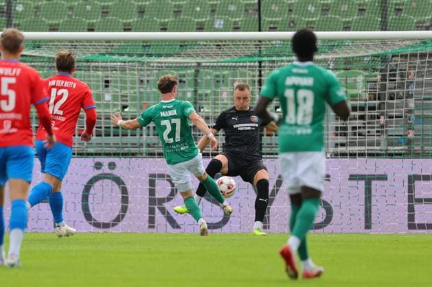 August 29, 2026, GER, Regionalliga Nord, Soccer, Matchday 6, 2026–2027 Season, VfB Lübeck vs. SV Drochtersen Assel; Felix Mandl (VfB Lübeck, No. 27) takes a shot on goal against goalkeeper Jesper Heim (SV Drochtersen Assel, No. 33); Lübeck; Dietmar Scholze Stadium at the Lohmühle, SH, Germany Copyright: xnordphotoxGmbHx xTauchnitzx