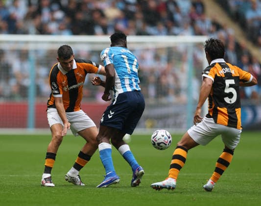 Coventry City v Hull City Premier League John Egan of Hull City and Hidemasa Morita of Hull City and Taiwo Awoniyi of Coventry City during the Premier League match at the Coventry Building Society Arena, Coventry 29 08 2026 UK Newspapers OUT Copyright: xAndyxSumnerx FIL-23836-0156