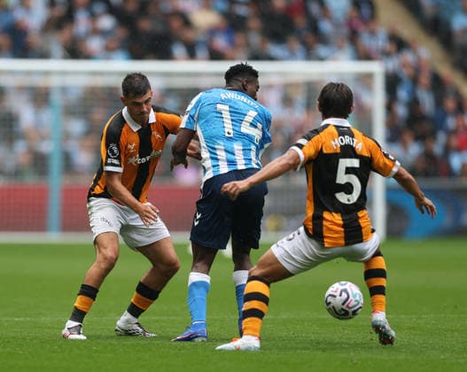 Coventry City v Hull City Premier League John Egan of Hull City and Taiwo Awoniyi of Coventry City and Hidemasa Morita of Hull City during the Premier League match at the Coventry Building Society Arena, Coventry 29 08 2026 UK Newspapers OUT Copyright: xAndyxSumnerx FIL-23836-0157