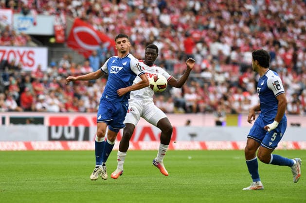 Albian Hajdari (TSG Hoffenheim) und Ragnar Ache (1. FC Koeln) im Zweikampf waehrend des Spiels der 1. Bundesliga zwischen 1. FC Koeln und TSG Hoffenheim, RheinEnergieStadion am 29. August 2026 in Koeln, Deutschland. (Foto von Ralf Treese DeFodi Images) +++ Albian Hajdari (TSG Hoffenheim) und Ragnar Ache (1. FC Koeln) battle for the ball during the Bundesliga match between 1. FC Koeln and TSG Hoffenheim at RheinEnergieStadion on August 29, 2026 in Cologne, Germany. (Photo by Ralf Treese DeFodi Images) DFB DFL REGULATIONS PROHIBIT ANY USE OF PHOTOGRAPHS AS IMAGE SEQUENCES AND OR QUASI-VIDEO. (Photo by Ralf Treese DeFodi Images) - *** Albian Hajdari of TSG Hoffenheim and Ragnar Ache of 1. FC Köln battle for the ball during the Bundesliga match between 1. FC Köln and TSG Hoffenheim at RheinEnergieStadion on August 29, 2026, in Cologne, Germany. Photo by Ralf Treese, DeFodi Images. Albian Hajdari of TSG Hoffenheim and Ragnar Ache of 1. FC Köln battle for the ball during the Bundesliga match between 1. FC Köln and TSG Hoffenheim at RheinEnergieStadion on August 29, 2026 in Cologne, Germany. Photo by Ralf Treese, DeFodi Images. DFB and DFL regulations prohibit any use of photographs as image sequences and or quasi-video. Photo by Ralf Treese, DeFodi Images.