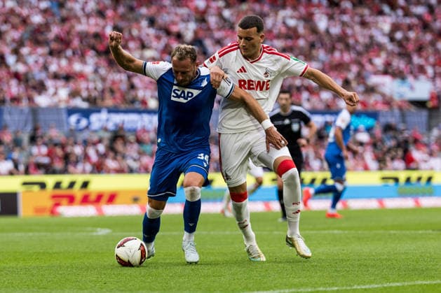 KOELN, GERMANY - AUGUST 29: Vladimir Coufal (TSG 1899 Hoffenheim, 34) and Said El Mala (1. FC Koeln, 10) battle for the ball during the Bundesliga match between 1. FC Koeln vs. TSG 1899 Hoffenheim at Rheinenergie-Stadion on matchday 1 of the 1. Bundesliga on August 29, 2026 in Koeln, Germany. DFL REGULATIONS PROHIBIT ANY USE OF PHOTOGRAPHS AS IMAGE SEQUENCES AND OR QUASI-VIDEO. North Rhine Westphalia Germany Copyright: xSteffiexWunderlx