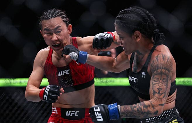 (260829) -- SHANGHAI, Aug. 29, 2026 -- Yan Xiaonan (L) of China competes against Denise Gomes of Brazil during the UFC Fight Night Women s Strawweight Bout 3 Rounds at the Oriental Sports Center in east China s Shanghai, Aug. 29, 2026. ) (SP)CHINA-SHANGHAI-ROAD TO UFC (CN) LixMing 