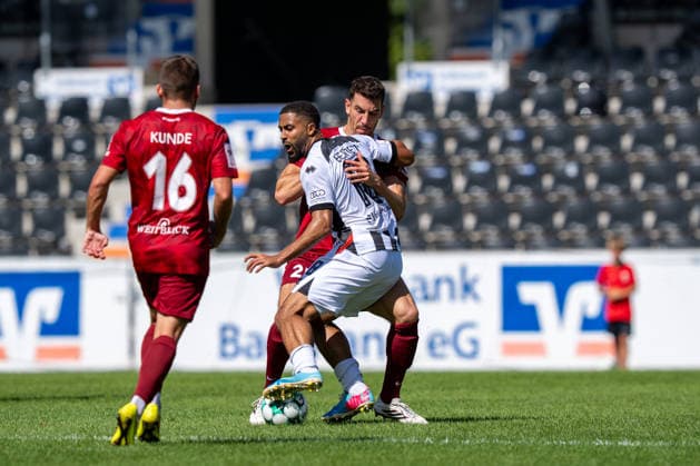 Tackle between Arbnor Nuraj of SG Sonnenhof Großaspach, 25, and Keanan Bennetts of FC Ingolstadt 04, 18, SG Sonnenhof Großaspach vs. FC Ingolstadt 04, Soccer, 3rd Division, Matchday 3, August 29, 2026, DFB regulations prohibit any use of photographs as image sequences and or quasi-video. Aspach, Baden-Württemberg, Germany Copyright: xkolbert-press PhilipxZieglerx