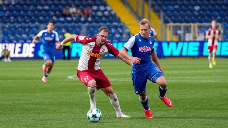 From left: Lucas Hermes (Regensburg), 27; Valentin Lässig (TSG II), 6; tackle, game scene, duel, tackle, tackling, dynamism, action, 08 29 2026, Sinsheim, Germany, soccer, 3rd Division, TSG 1899 Hoffenheim II vs. SSV Jahn Regensburg, DFB and DFL regulations prohibit any use of photographs as image sequences and or quasi-video xozx