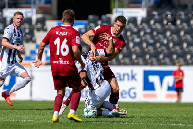 Tackle between Arbnor Nuraj of SG Sonnenhof Großaspach, 25, and Keanan Bennetts of FC Ingolstadt 04, 18, SG Sonnenhof Großaspach vs. FC Ingolstadt 04, Soccer, 3rd Division, Matchday 3, August 29, 2026, DFB regulations prohibit any use of photographs as image sequences and or quasi-video. Aspach, Baden-Württemberg, Germany Copyright: xkolbert-press PhilipxZieglerx