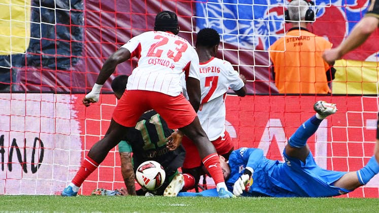 Bundesliga, 2026–2027 Season, Matchday 1, RB Leipzig vs. VfL 1900 Borussia Mönchengladbach, August 29, 2026. Maarten Vandevoordt, goalkeeper for RB Leipzig, No. 26, in the middle, deflects a shot on goal to the post during the Bundesliga match between Leipzig and Mönchengladbach on August 29, 2026, and saves the follow-up shot from Tim Kleindienst, center forward for Borussia Mönchengladbach, No. 11, Ridle Baku, right back for RB Leipzig, No. 17, Castello Lukeba, center back for RB Leipzig, No. 23, also involved. Leipzig, Saxony, Germany, Red Bull Arena
