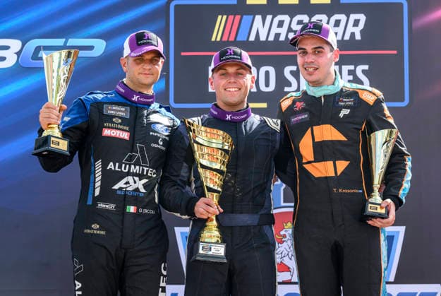 NASCAR, Motorsport, USA Euro Series, category EuroNASCAR V8GP, took place in Most, Czech Republic, on August 29, 2026. From left: Gianmarco Ercoli from Italy of the ALUMITEC Racing team, who finished second, winner Jordan O Brien from the USA of the Hendriks Motorsports team and Thomas Krasonis from Greece of the PK Carsport team. (CTKxPhoto OndrejxHajek) CTKPhotoP2026082904054  CTKPhotoP2026082904054