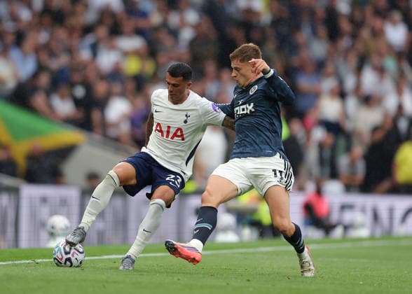 29th August 2026; Tottenham Hotspur Stadium, London, England; Premier League Football, Tottenham Hotspur versus Newcastle United; Pedro Porro of Tottenham Hotspur under pressure from Harvey Barnes of Newcastle United JohnxPatrickxFletcher
