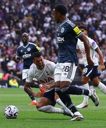 Pedro Porro of Tottenham Hotspur falls down under pressure from Joe Willock of Newcastle United Tottenham Hotspur v Newcastle United, Premier League Football, Football, Tottenham Hotspur Stadium, London, UK - 29 Aug 2026London Tottenham Hotspur Stadium United Kingdom EDITORIAL USE ONLY No use with unauthorised audio, video, data, fixture lists, club league logos or live services. Online in-match use limited to 120 images, no video emulation. No use in betting, games or single club league player publications. Copyright: xMichaelxZemanek Shutterstockx 17119028r