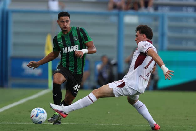Sassuolo™s Simone Cinquegrano fights for the ball with Torino™s Alessio Cacciamani during the Serie A soccer match between Sassuolo and Torino at the Mapei Stadium in Reggio Emilia, north east Italy - August1 29, 2026. - Soccer  Copyright: xGiannixSantandrea LaPressex