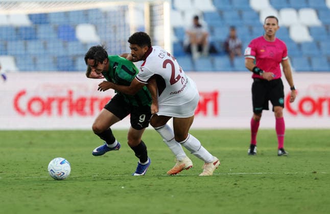 Torino™s Saul Coco fights for the ball with Sassuolo™s Kieron Bowie during the Serie A soccer match between Sassuolo and Torino at the Mapei Stadium in Reggio Emilia, north east Italy - August1 29, 2026. - Soccer  Copyright: xGiannixSantandrea LaPressex