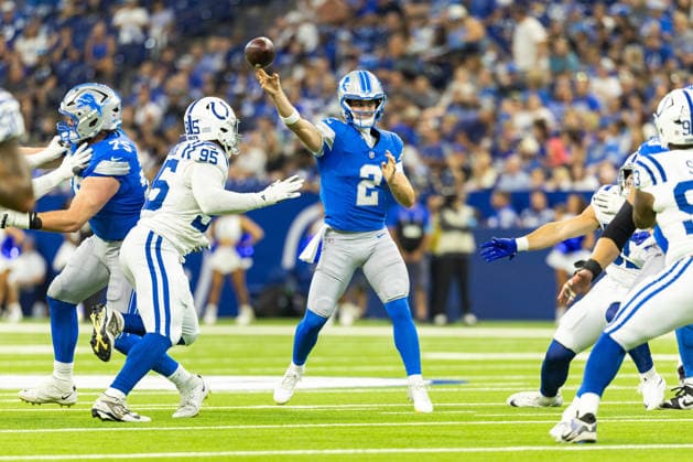 Aug 29, 2026; Indianapolis, Indiana, USA; Detroit Lions defensive back Ennis Rakestraw Jr. (2) passes the ball as Indianapolis Colts defensive lineman Adetomiwa Adebawore (95) pursues during NFL, American Football Herren, USA preseason game action at Lucas Oil Stadium. Mandatory Credit: -Cal Media NFL 2026: Lions Vs Colts AUG 29  - ZUMAc04_ 20260829_zma_c04_011 Copyright: xJohnxMersitsx