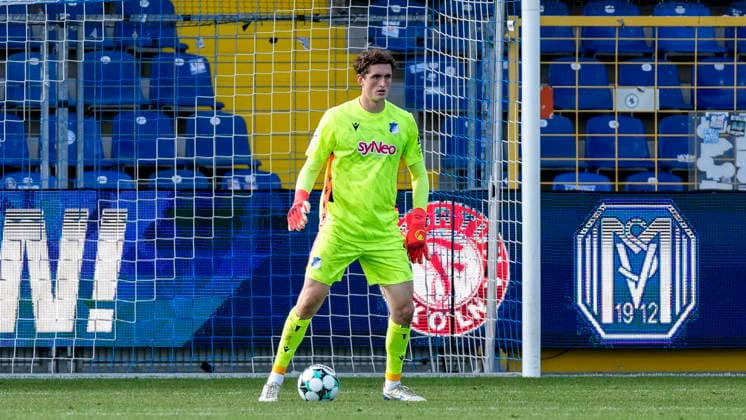 Lukas Petersson, Goalkeeper, TSG II, 1, with the ball, isolated, full-body, single frame, single photo, action, 08 29 2026, Sinsheim, Germany, soccer, 3rd League, TSG 1899 Hoffenheim II vs. SSV Jahn Regensburg, DFB and DFL regulations prohibit any use of photographs as image sequences and or quasi-video xozx