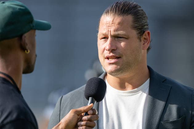 EFA President Markus Kuhn speaks into a handheld microphone during a pregame interview on the sideline. 29.08.2026, Innsbruck, European Football Alliance, Championship Game, Munich Ravens - Nordic Storm. Innsbruck Tivoli Stadium Austria Copyright: xPFA RicoxDoninellix