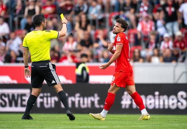 SOCCER REGIONAL LEAGUE NORTHEAST 2026–2027 SEASON, MATCHDAY 7: FC ROT WEISS ERFURT VS. BFC PREUSSEN ** FOR EDITORIAL PURPOSES ONLY ** EDITORIAL USE ONLY ** p August 29, 2026 Erfurt Soccer Regional League Northeast Matchday 7, 2026–2027 Season, Steigerwald Stadium: FC Rot Weiss Erfurt vs. BFC Preussen. In the photo, referee Patrick Kluge shows Romarjo Hajrulla (No. 9, FC Rot Weiss Erfurt) a yellow card Germany Thuringia Erfurt Copyright SaschaxFromm Copyright: SaschaxFromm doc87dl4lvxok4spnzr9ul ,EDITORIAL USE ONLY Copyright: SaschaxFromm