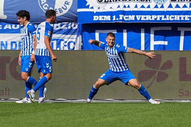 30.08.2026, xydrx, Fußball, 2. Fußball Bundesliga, 1.FC Magdeburg - Holstein Kiel, Saison 2026 2027, Avnet Arena: Torjubel nach dem Tor zum 1:0 für den 1.FC Magdeburg durch Torschütze Mateusz Zukowski (1.FC Magdeburg, 22) zusammen mit Tobias Mueller (1.FC Magdeburg, 5) und Anselmo Garcia MacNulty (1.FC Magdeburg, 3) DFB regulations prohibit any use of photographs as image sequences and or quasi-video. *** August 30, 2026, xydrx, soccer, 2. Bundesliga, 1. FC Magdeburg vs. Holstein Kiel, 2026–2027 season, Avnet Arena: Celebrations after the 1–0 goal for 1 FC Magdeburg scored by Mateusz Zukowski (1 FC Magdeburg, 22), along with Tobias Mueller (1 FC Magdeburg, 5) and Anselmo Garcia MacNulty (1 FC Magdeburg, 3 DFB regulations prohibit any use of photographs as image sequences and or quasi-video Copyright: HMBxMedia YannisxDreimann