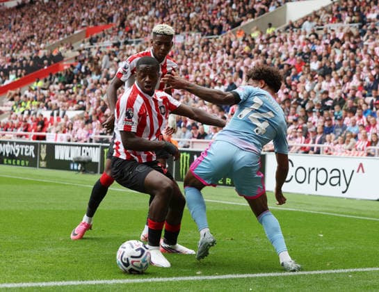 Sunderland, England, 30th August 2026. Noah Sadiki of Sunderland tussles with Oscar Bobb of Fulham during the Sunderland vs Fulham Premier League match at the Stadium Of Light, Sunderland. Picture credit should read: Nigel Roddis Sportimage EDITORIAL USE ONLY. No use with unauthorised audio, video, data, fixture lists, club league logos or live services. Online in-match use limited to 120 images, no video emulation. No use in betting, games or single club league player publications. SPI_008_NR_Sunderland_Fulham SPI-4949-0008
