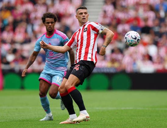 Sunderland, England, 30th August 2026. Granit Xhaka of Sunderland intercepts Oscar Bobb of Fulham during the Sunderland vs Fulham Premier League match at the Stadium Of Light, Sunderland. Picture credit should read: Nigel Roddis Sportimage EDITORIAL USE ONLY. No use with unauthorised audio, video, data, fixture lists, club league logos or live services. Online in-match use limited to 120 images, no video emulation. No use in betting, games or single club league player publications. SPI_010_NR_Sunderland_Fulham SPI-4949-0009