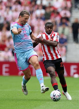 Sunderland, England, 30th August 2026. Sander Berge of Fulham tussles with Noah Sadiki of Sunderland during the Sunderland vs Fulham Premier League match at the Stadium Of Light, Sunderland. Picture credit should read: Nigel Roddis Sportimage EDITORIAL USE ONLY. No use with unauthorised audio, video, data, fixture lists, club league logos or live services. Online in-match use limited to 120 images, no video emulation. No use in betting, games or single club league player publications. SPI_009_NR_Sunderland_Fulham SPI-4949-0011