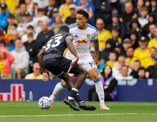Leeds, England, 30th August 2026. Michael Kayode of Brentford tussles with Noah Okafor of Leeds United during the Leeds United vs Brentford Premier League match at Elland Road, Leeds. Picture credit should read: James Baylis Sportimage EDITORIAL USE ONLY. No use with unauthorised audio, video, data, fixture lists, club league logos or live services. Online in-match use limited to 120 images, no video emulation. No use in betting, games or single club league player publications. SPI_013_JB_Leeds_Brentford SPI-4950-0013
