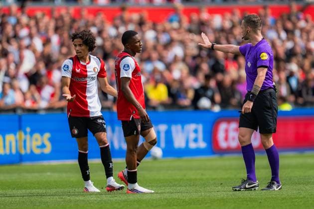 ROTTERDAM , 30-08-2026 , Stadium feijenoord De Kuip , season 2025 2026 , Dutch Eredivisie football , match between Feyenoord and ADO Den Haag , picture shows Feyenoord player Gjivai Zechiel, Feyenoord player Givairo Read and referee Robin Hensgens Feyenoord - ADO  x206245855x Copyright: