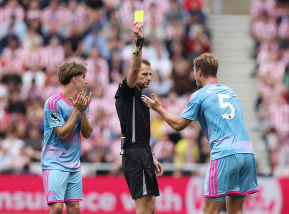 Sunderland, England, 30th August 2026. Referee Michael Salisbury issues a yellow card to Joachim Andersen of Fulham during the Sunderland vs Fulham Premier League match at the Stadium Of Light, Sunderland. Picture credit should read: Nigel Roddis Sportimage EDITORIAL USE ONLY. No use with unauthorised audio, video, data, fixture lists, club league logos or live services. Online in-match use limited to 120 images, no video emulation. No use in betting, games or single club league player publications. SPI_012_NR_Sunderland_Fulhamx SPI-4949-0013