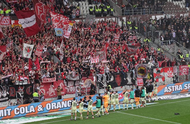 Kaiserslautern fans celebrate their team: Soccer, 2nd Division, 2026–2027 Men s Season, FC St. Pauli vs. 1. FC Kaiserslautern, 1–2. DFL regulations prohibit any use of photographs as image sequences and or quasi-video.
