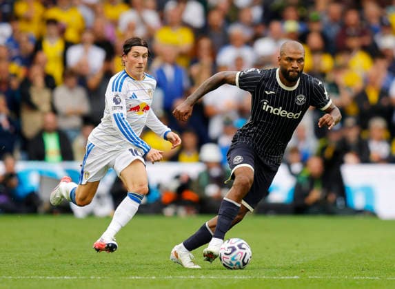 Leeds, England, 30th August 2026. Harry Wilson of Leeds United tussles with Igor Thiago of Brentford during the Leeds United vs Brentford Premier League match at Elland Road, Leeds. Picture credit should read: James Baylis Sportimage EDITORIAL USE ONLY. No use with unauthorised audio, video, data, fixture lists, club league logos or live services. Online in-match use limited to 120 images, no video emulation. No use in betting, games or single club league player publications. SPI_031_JB_Leeds_Brentford SPI-4950-0031