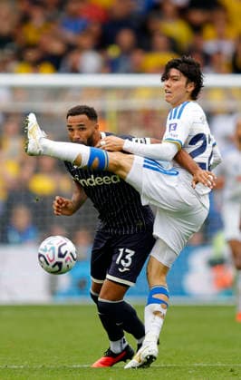 Leeds, England, 30th August 2026. Callum Wilson of Brentford tussles with Ao Tanaka of Leeds United during the Leeds United vs Brentford Premier League match at Elland Road, Leeds. Picture credit should read: James Baylis Sportimage EDITORIAL USE ONLY. No use with unauthorised audio, video, data, fixture lists, club league logos or live services. Online in-match use limited to 120 images, no video emulation. No use in betting, games or single club league player publications. SPI_041_JB_Leeds_Brentford SPI-4950-0040