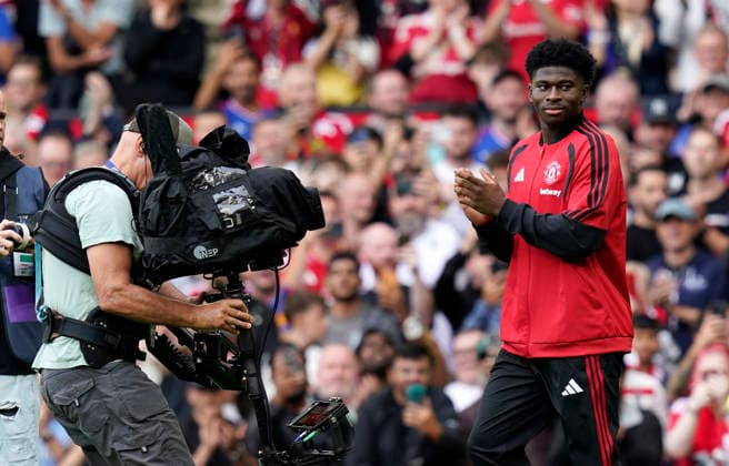 Manchester, England, 30th August 2026. New signing Carlos Baleba of Manchester United, ManU is introduced to the crowd before the Manchester United vs Ipswich Town Premier League match at Old Trafford, Manchester. Picture credit should read: Andrew Yates Sportimage EDITORIAL USE ONLY. No use with unauthorised audio, video, data, fixture lists, club league logos or live services. Online in-match use limited to 120 images, no video emulation. No use in betting, games or single club league player publications. SPI_021_AY_Man_Utd_Ipswich SPI-4945-0021