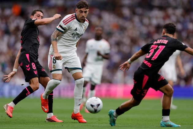 Federico Valverde of Real Madrid CF and Carlos Dotor of Málaga CF battle for the ball during the LaLiga EA Sports match between Real Madrid CF and Málaga CF at Estadio Santiago Bernabéu on August 30, 2026, in Madrid, Spain. Photo by Manu Reino, DeFodi Images
