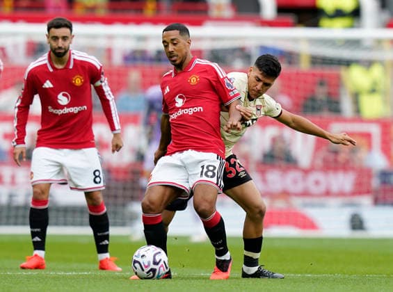 Manchester, England, 30th August 2026. Youri Tielemans of Manchester United, ManU tackled by Marcelino Nunez of Ipswich Town (r) during the Manchester United vs Ipswich Town Premier League match at Old Trafford, Manchester. Picture credit should read: Andrew Yates Sportimage EDITORIAL USE ONLY. No use with unauthorised audio, video, data, fixture lists, club league logos or live services. Online in-match use limited to 120 images, no video emulation. No use in betting, games or single club league player publications. SPI_025_AY_Man_Utd_Ipswich SPI-4945-0024