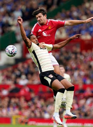 Manchester, England, 30th August 2026. Harry Maguire of Manchester United, ManU challenges Emersonn of Ipswich Town during the Manchester United vs Ipswich Town Premier League match at Old Trafford, Manchester. Picture credit should read: Andrew Yates Sportimage EDITORIAL USE ONLY. No use with unauthorised audio, video, data, fixture lists, club league logos or live services. Online in-match use limited to 120 images, no video emulation. No use in betting, games or single club league player publications. SPI_029_AY_Man_Utd_Ipswich SPI-4945-0029