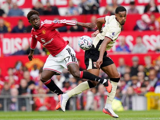 Manchester, England, 30th August 2026. Kobbie Mainoo of Manchester United, ManU challenges Emersonn of Ipswich Town during the Manchester United vs Ipswich Town Premier League match at Old Trafford, Manchester. Picture credit should read: Andrew Yates Sportimage EDITORIAL USE ONLY. No use with unauthorised audio, video, data, fixture lists, club league logos or live services. Online in-match use limited to 120 images, no video emulation. No use in betting, games or single club league player publications. SPI_035_AY_Man_Utd_Ipswich SPI-4945-0035