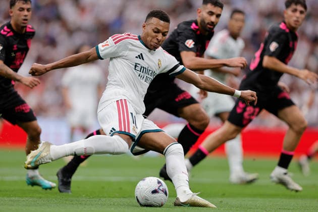 Kylian Mbappé takes a shot for Real Madrid CF during the LaLiga EA Sports match between Real Madrid CF and Málaga CF at Estadio Santiago Bernabéu on August 30, 2026, in Madrid, Spain. Photo by Manu Reino, DeFodi Images