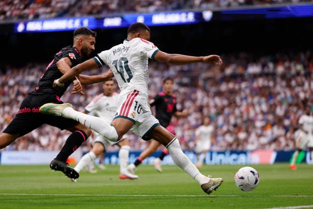 Kylian Mbappé takes a shot for Real Madrid CF during the LaLiga EA Sports match between Real Madrid CF and Málaga CF at Estadio Santiago Bernabéu on August 30, 2026, in Madrid, Spain. Photo by Manu Reino, DeFodi Images