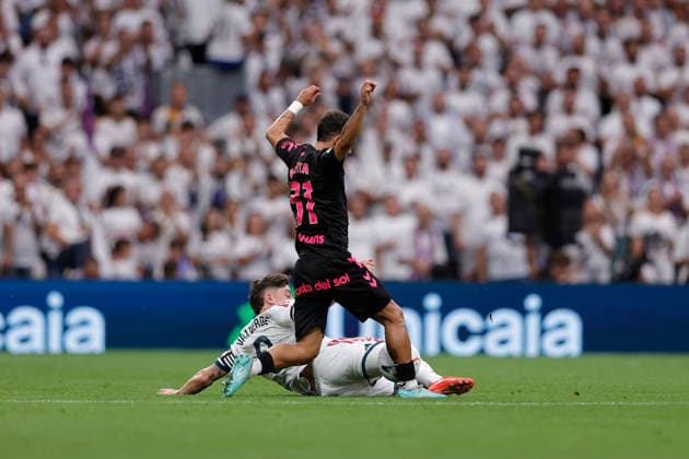 Federico Valverde of Real Madrid CF and Rafita Garrido of Málaga CF battle for the ball during the LaLiga EA Sports match between Real Madrid CF and Málaga CF at Estadio Santiago Bernabéu on August 30, 2026, in Madrid, Spain. Photo by Manu Reino, DeFodi Images